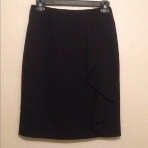 Kasper black with a side ruffle skirt